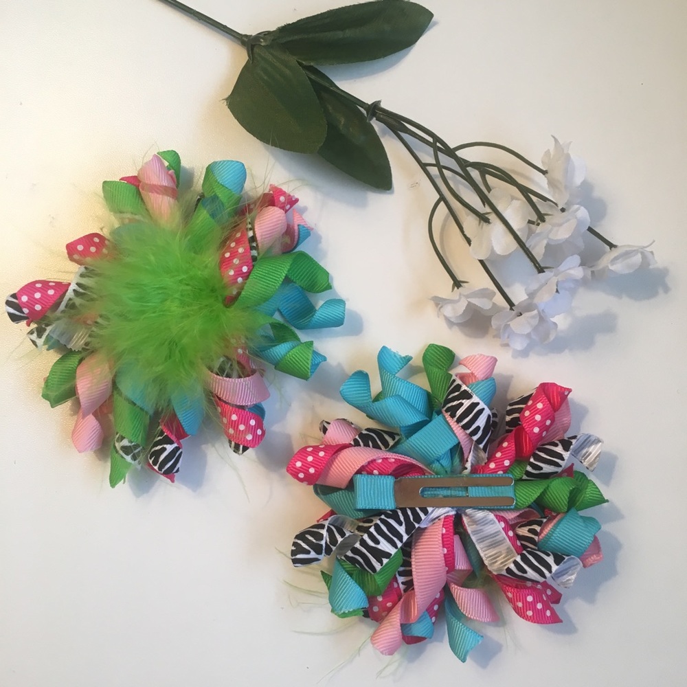 Girls korker bows. Bright colors with feathers.